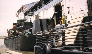 Dong Tam May 1967. Boats of RivRon-9 alongside YRBM-17.