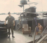 This is me (a lot younger and thinner) in fall of 1970 on the first VN boat I was assigned to. We are tied up to one of the Benewah's pontoons. It was anchored about 3 miles from the Cambodian border.  The alpha boat had "HQ5166" on the hull. The HQ was for "Hai Quan" which is Vietnamese for "Navy". I don't know if the 5166 had any significance  and I don't know what the American hull number was. I know the boat came from a unit at Dong Tam. My first outing was a real revelation. After about 80 years of war, the Vietnamese were in no hurry to make contact. They were content with staying in the widest part of the river and sit in their deck chairs.